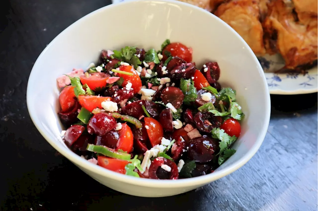 Grilled spiced chicken with sweet cherry and tomato salad makes quick, easy summer delight