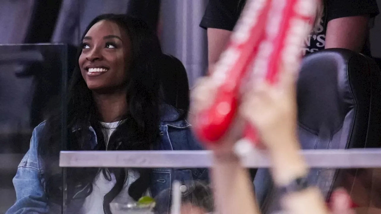 Olympic Gold Medalist Simone Biles Enjoys 1st WNBA Game, Attends Sun-Fever Matchup