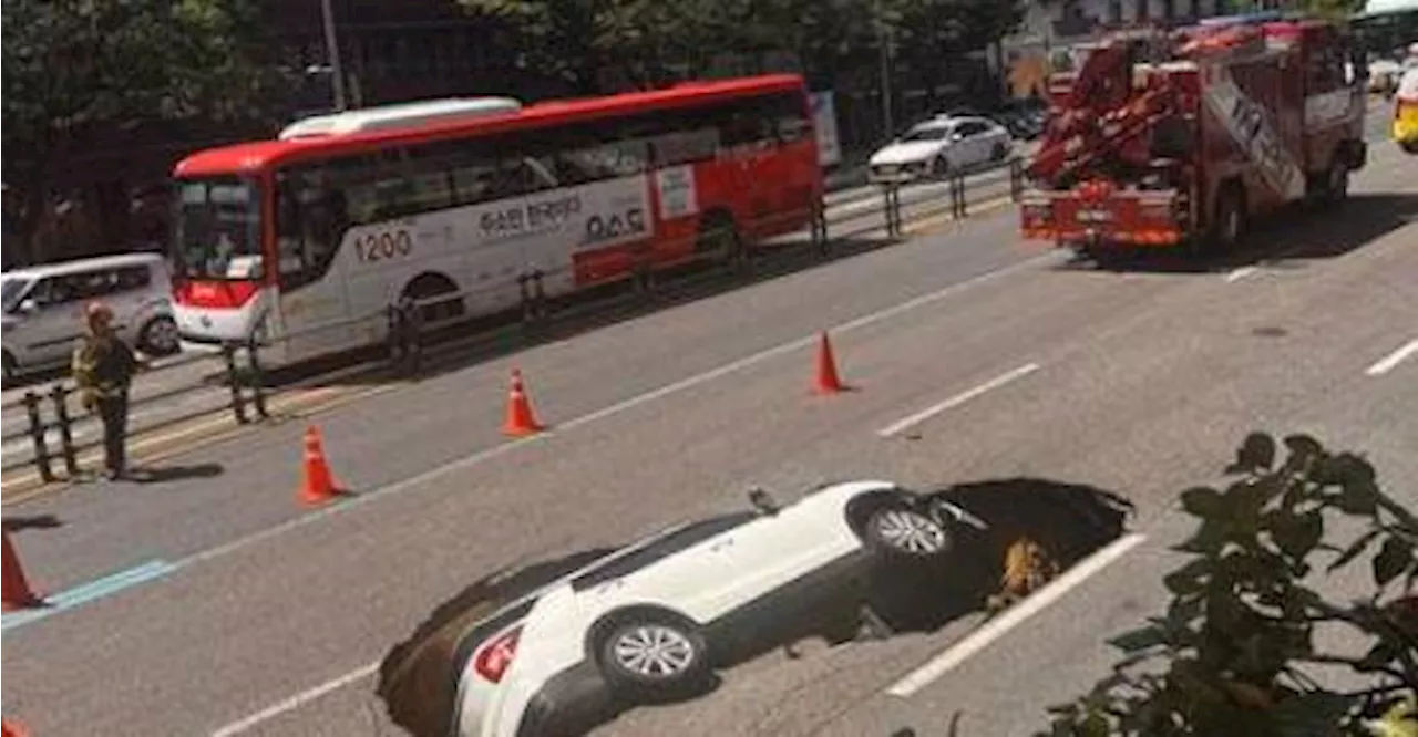 SUV swallowed by 2.5m deep sinkhole in Korea, victims rescued