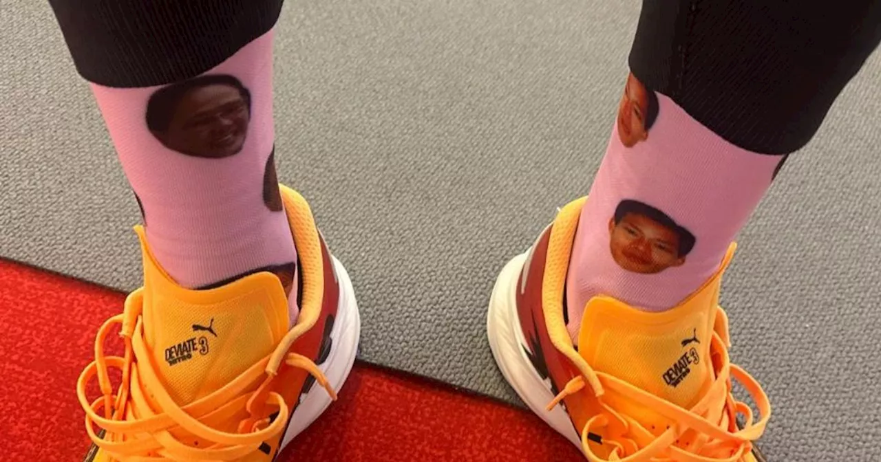 EJ Obiena opens Paris bid wearing socks with parents' faces printed on it