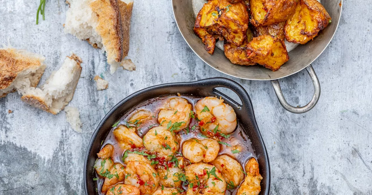 Prawns pil pil with roasted potatoes and crusty bread