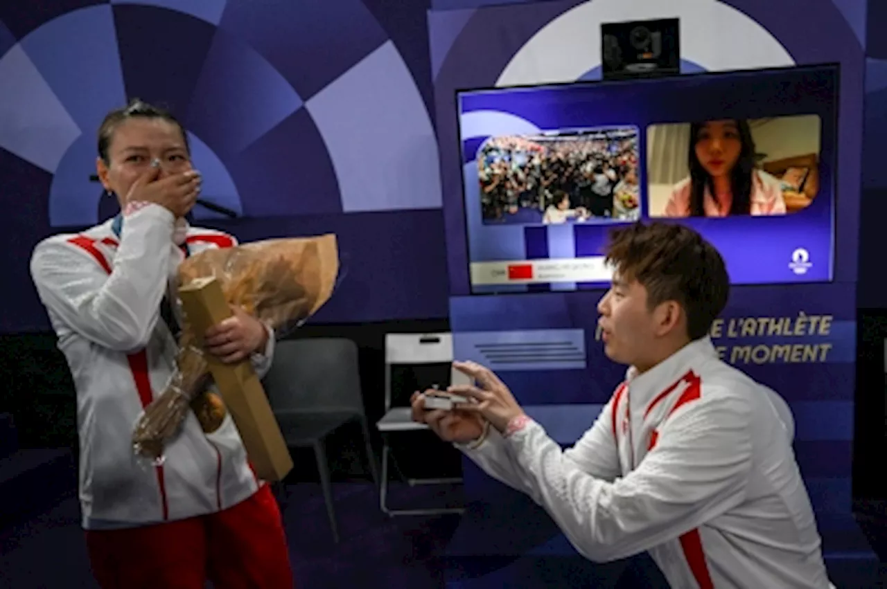 Love is in the air! China's Huang Yaqiong wins badminton mixed doubles gold - and a marriage proposal and diamond ring