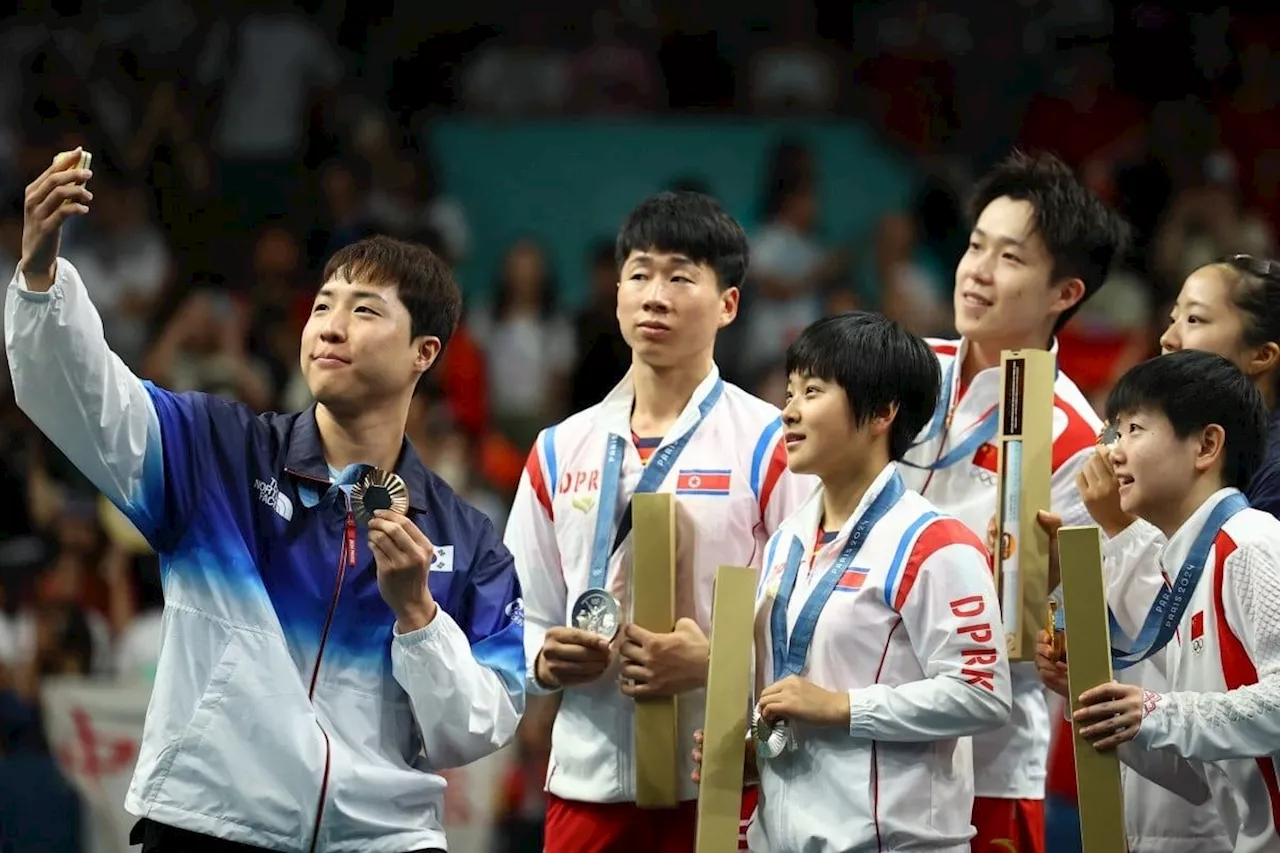 Selfie of North and South Korean, Chinese paddlers called Games’ ‘most significant photo’