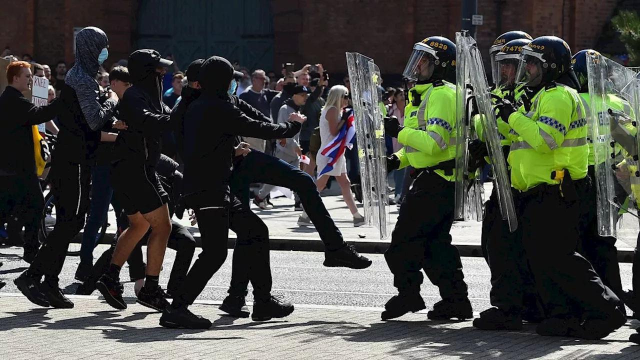 Police officers in hospital after violent protests across UK cities continue