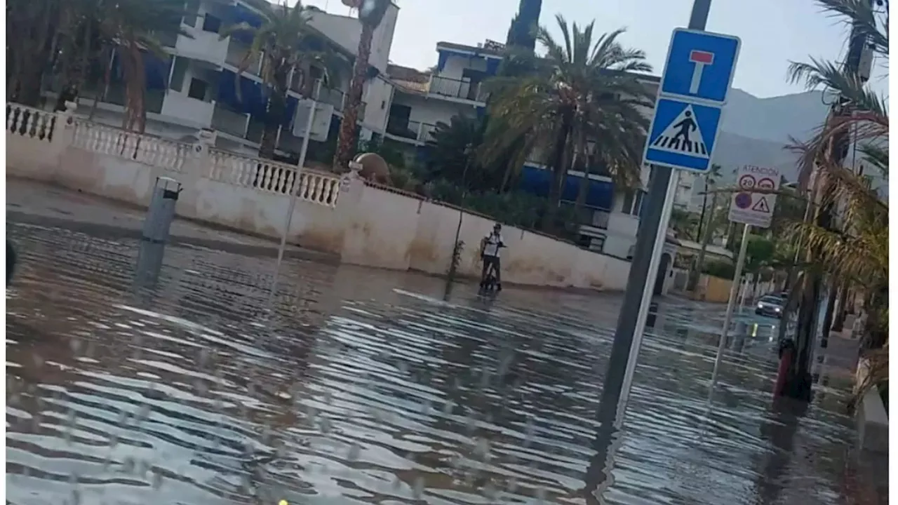 Moment hols hotspot Benidorm is battered by hailstorm & rain turns roads into rivers