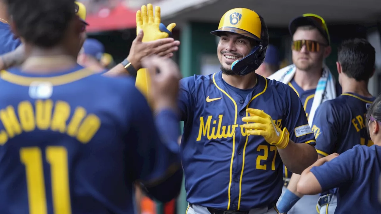 Brewers beat the Reds in 10 innings in the first game of a doubleheader