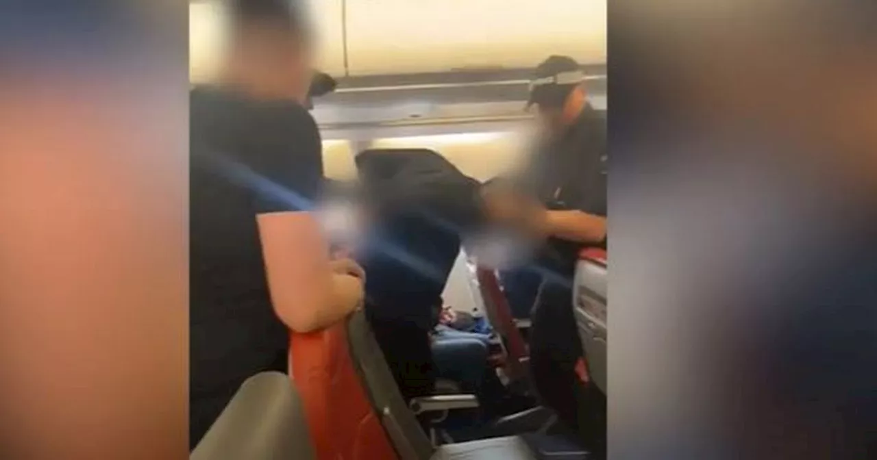 Moment Jet2 passenger is hurled off plane at Manchester Airport