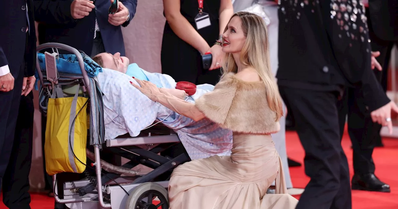 Angelina Jolie stops to greet fan with rare bone disorder during red carpet for 'Maria'