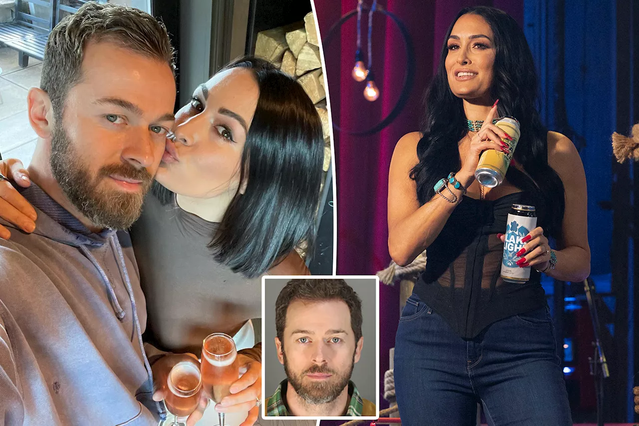 Artem Chigvintsev said wife Nikki Bella threw a shoe at him before arrest: 911 call