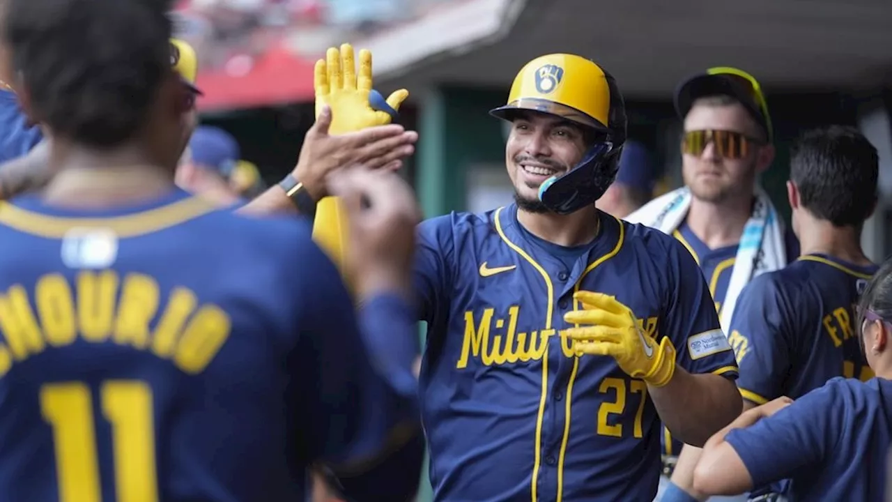 Brewers beat Reds in 10 innings in first game of a doubleheader