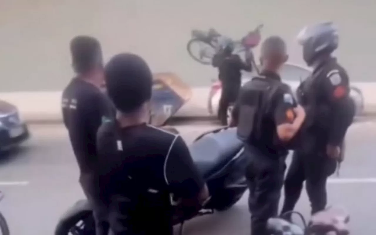 Vídeo: PM joga bicicleta em caçamba de lixo durante abordagem na Zona Norte