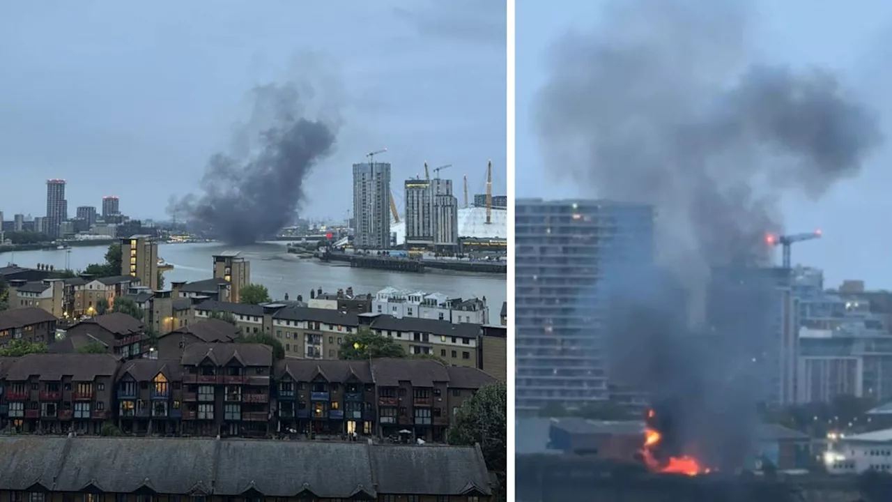 Explosion and smoke plume blacken London sky as firefighters rush to scene of 'pre-planned explosion'