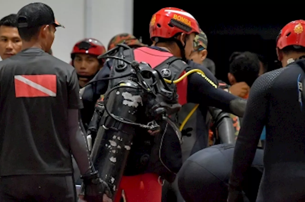 Rescuers use telescopic cam at Jalan Masjid India sinkhole as search gets too dicey for divers