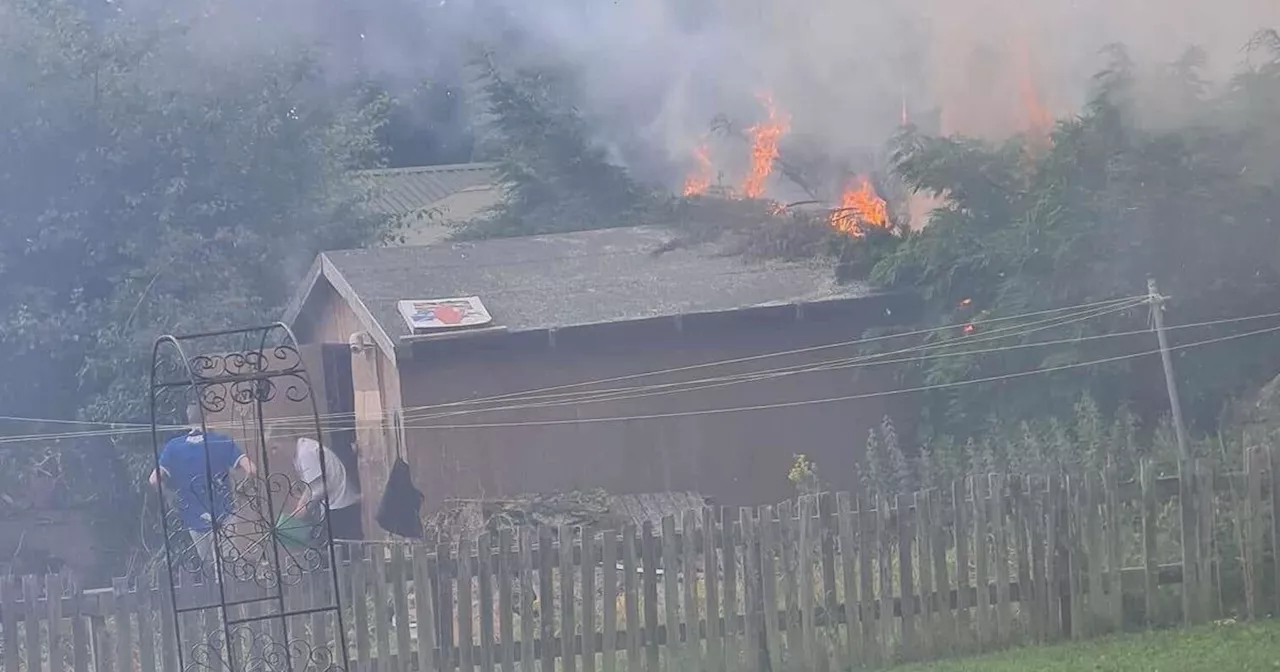 Scots neighbours run into burning shed to remove gas canisters amid blaze