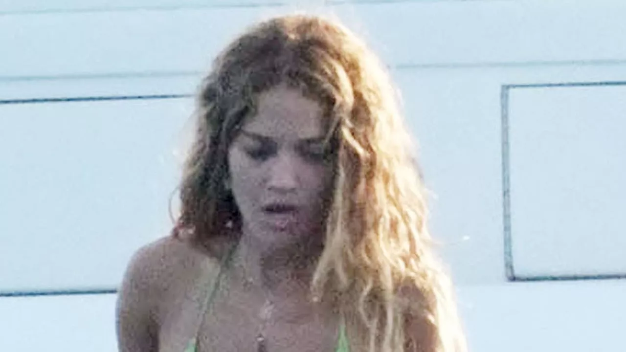 Rita Ora displays her incredible figure in a skimpy green bikini as she enjoys a yacht day with...