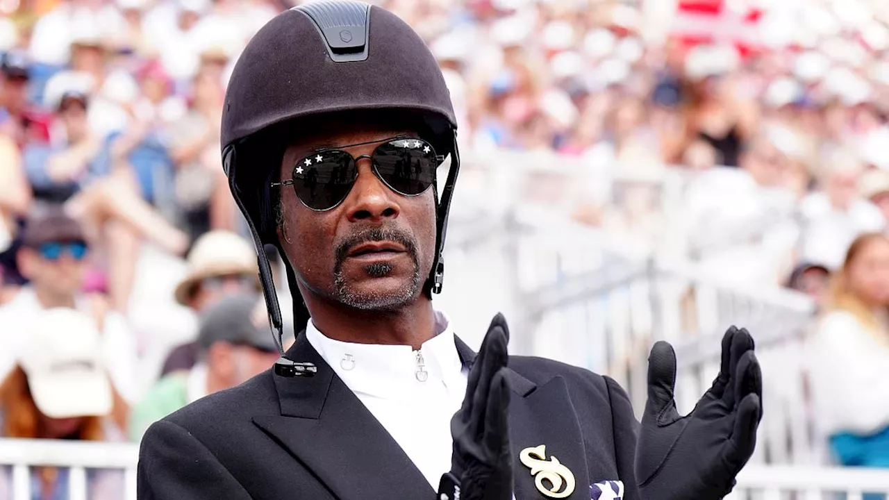 Snoop Dogg dons full equestrian kit as he watches dressage with Martha Stewart at Paris Olympics