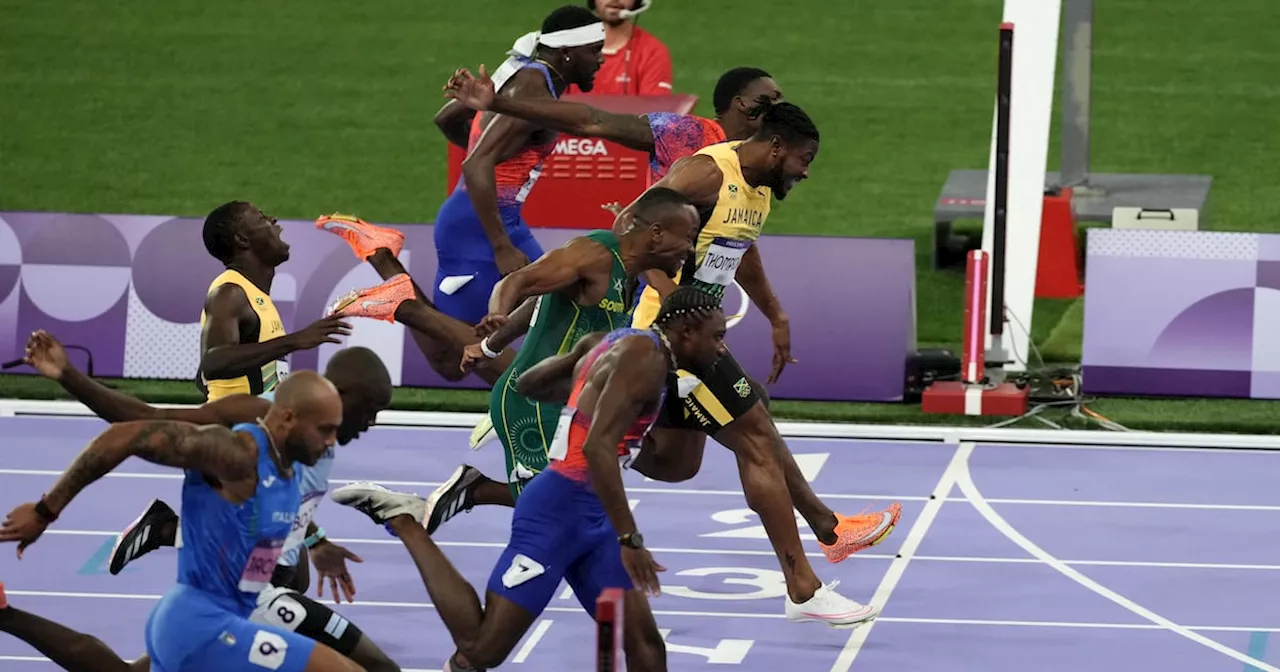 Noah Lyles takes men’s 100m gold by narrowest margin in dramatic Olympic final