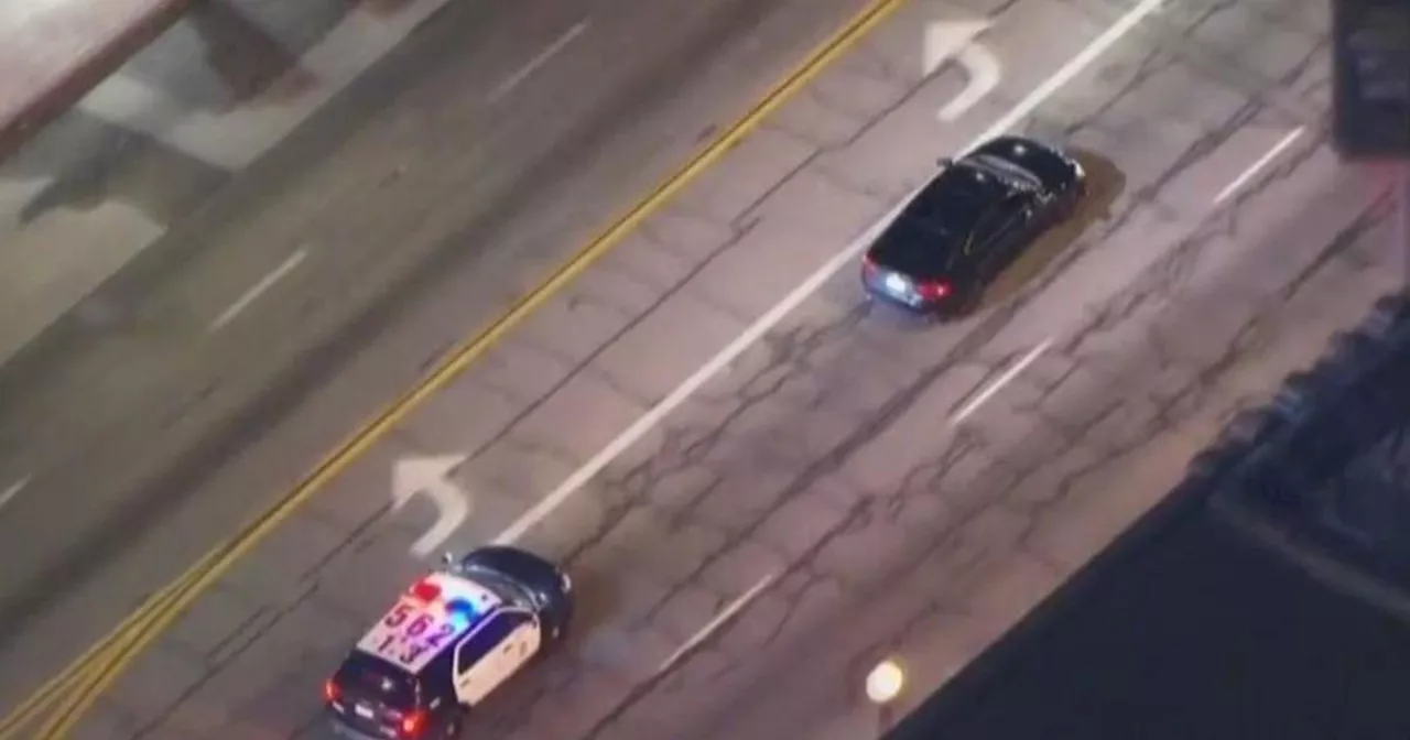 Armed suspect ditches stolen vehicle and jumps into getaway vehicle during pursuit