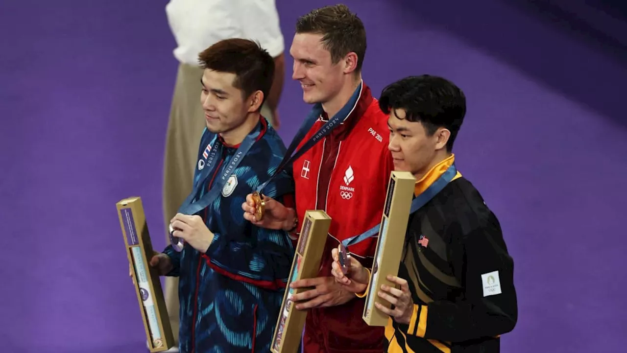 Denmark's Axelsen retains mens' Olympic badminton title