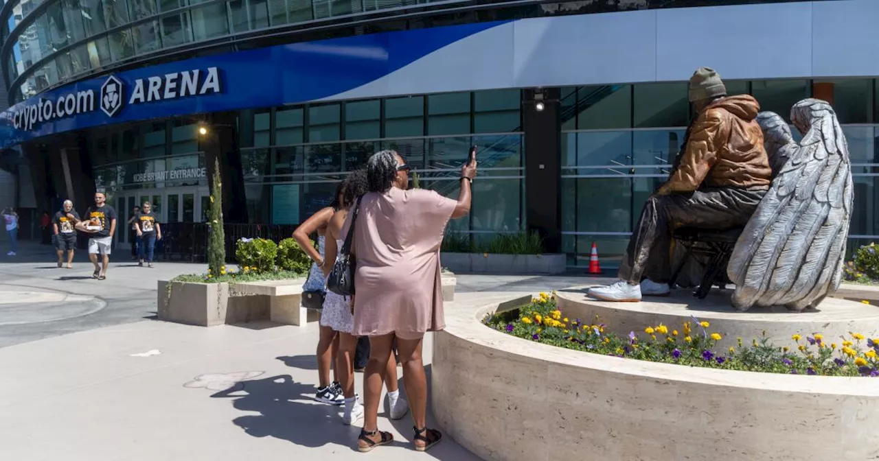 Kobe Bryant and Gianna are sitting near Crypto.com Arena entrance named after Lakers icon