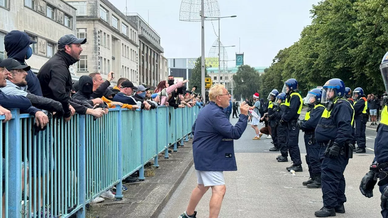 Arrests 'ongoing' as police van damaged in Plymouth as rioters clash with counter-protesters