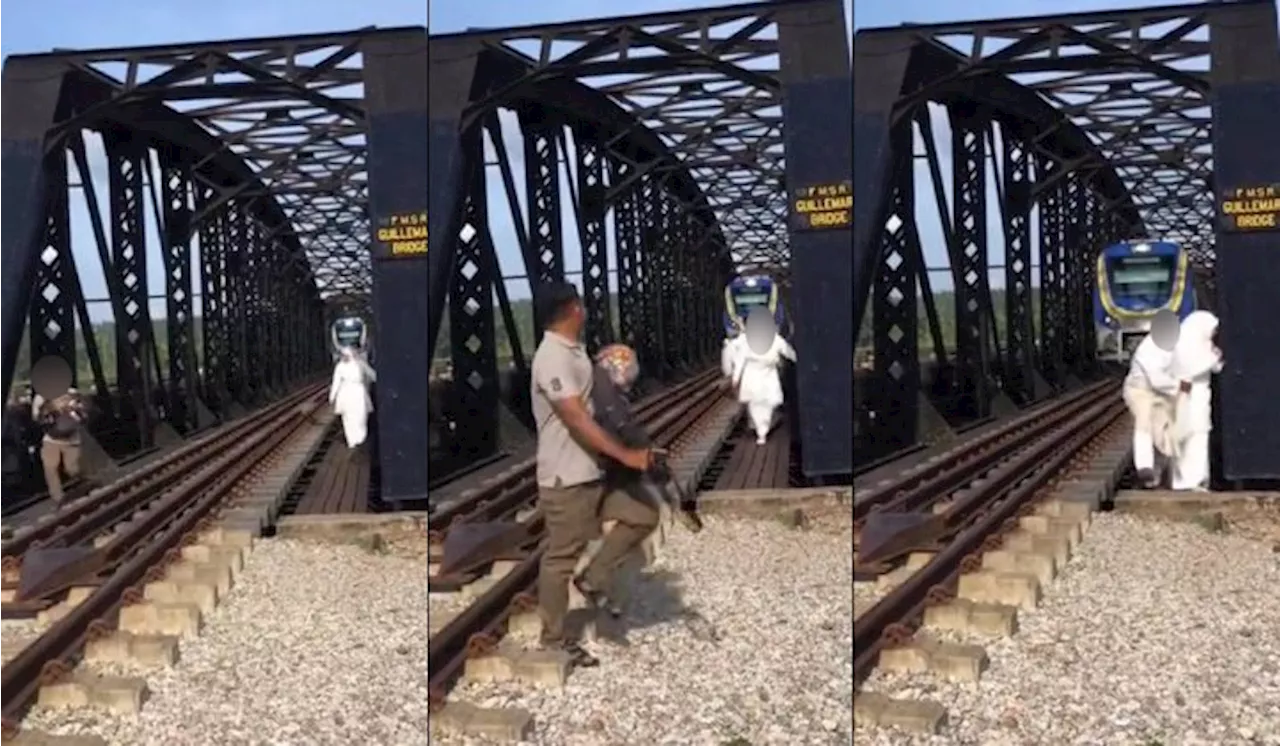 [Video] Pengantin Hampir Dilanggar Tren Di Jambatan Guillemard Gara-gara ‘Photoshoot’ Kahwin