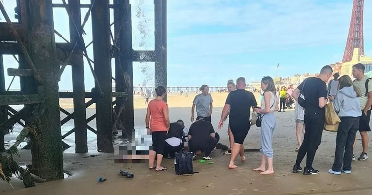 Shocking moment woman falls through hole in Blackpool pier