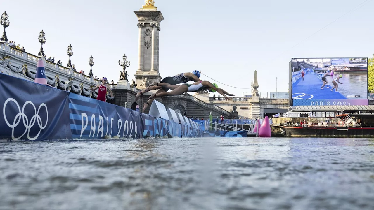 Amid concerns about dirty water and strong current, marathon swimmers dive into the Seine River