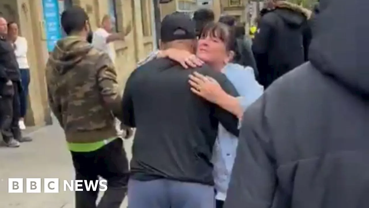 Muslim counter-protesters embraced by pub-goers in Accrington