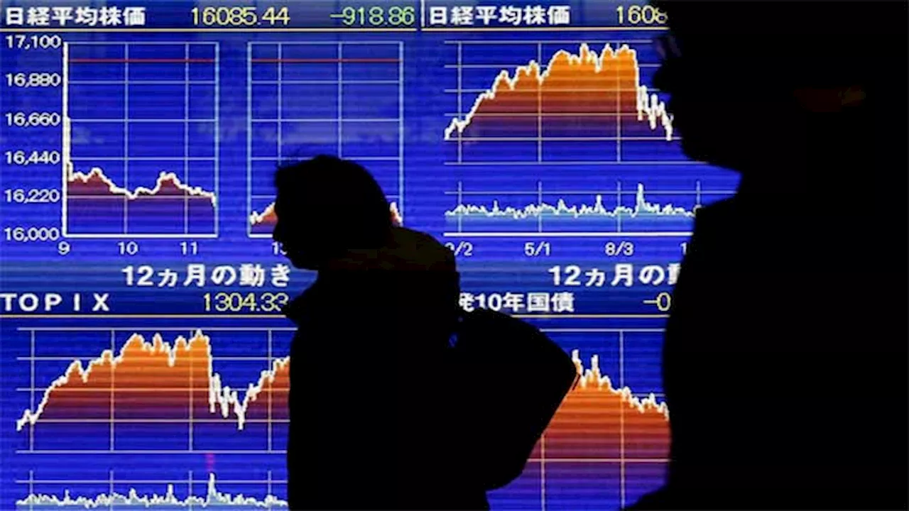 Asia stocks buoyant, yen slumps after BOJ talks down rate hikes