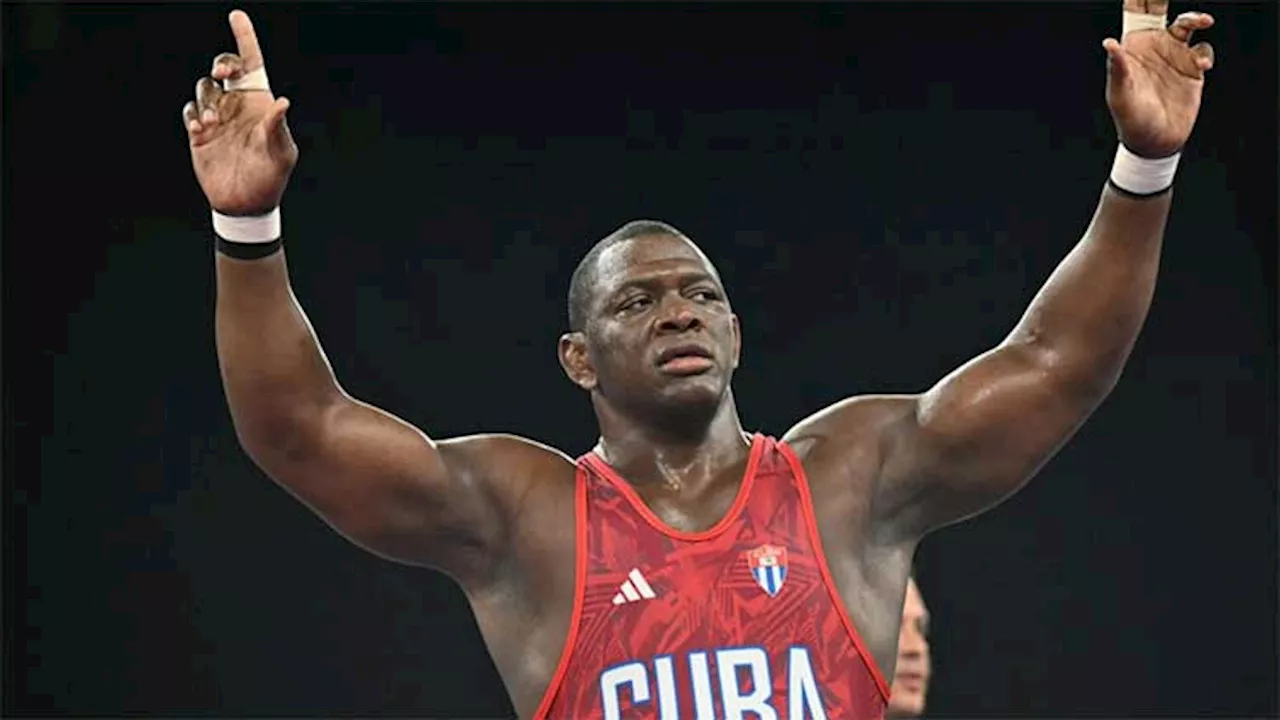 Cuban wrestler Lopez wins record fifth straight Olympic gold, immediately retires