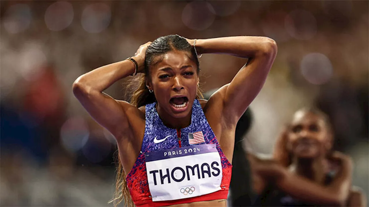 Thomas takes Olympic 200m, Hocker streaks to shock 1500m victory