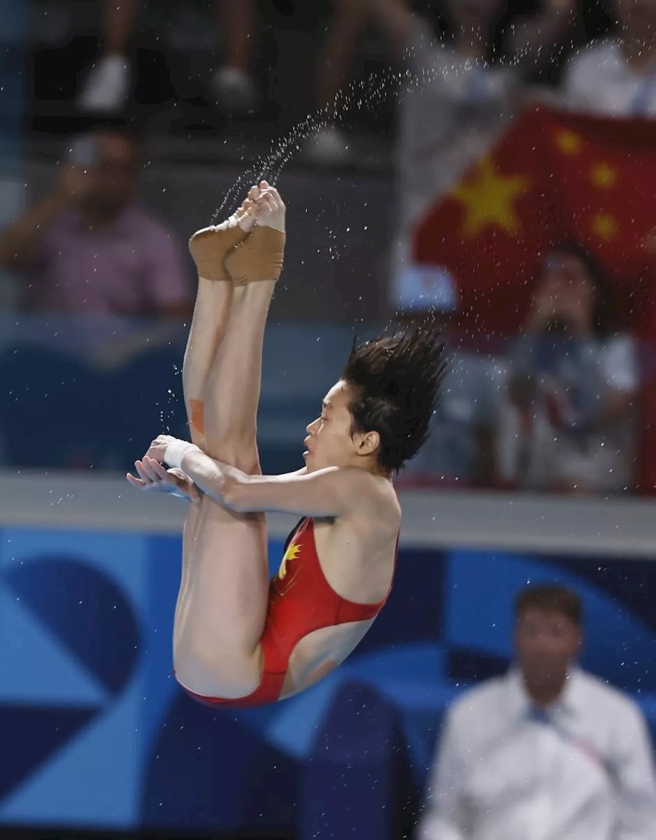 Quan wins 3rd Olympic diving gold at age 17