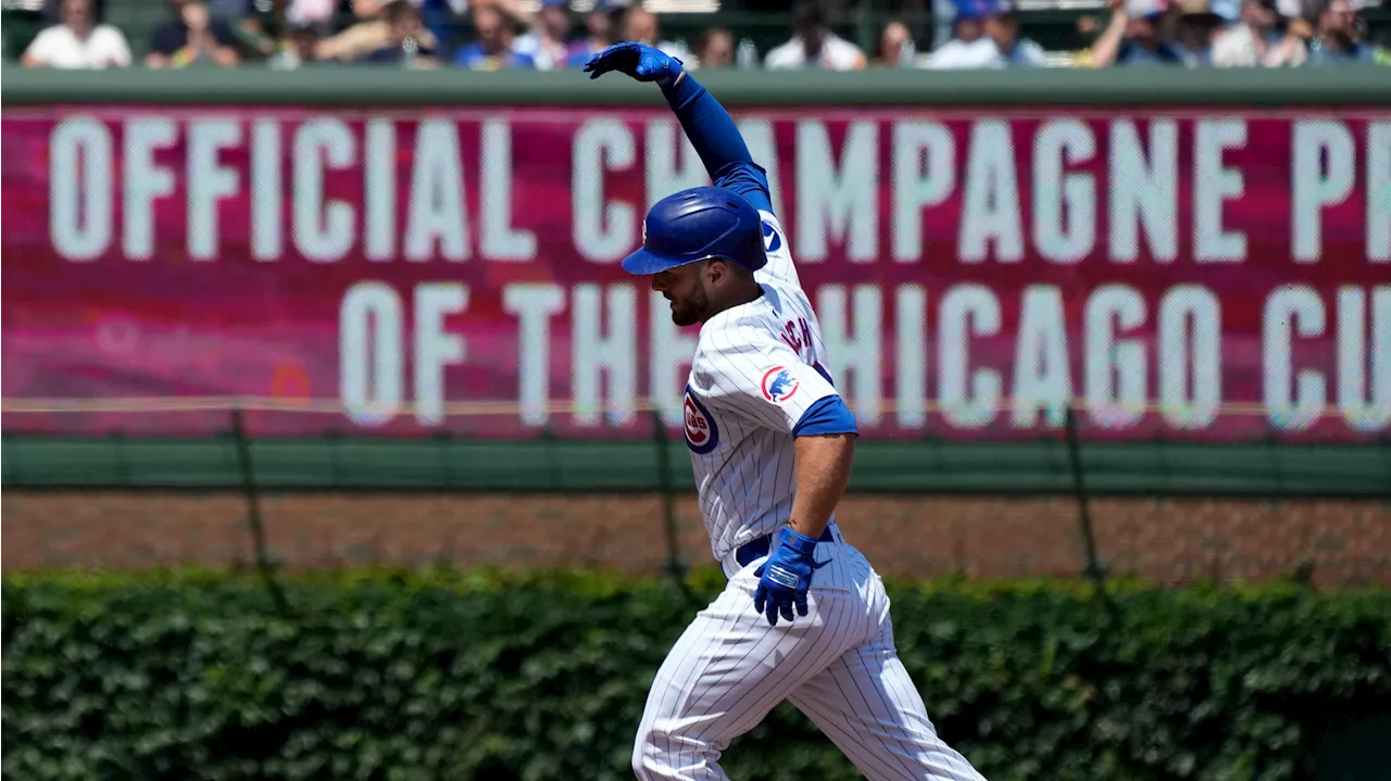 Happ, Busch power Cubs past Twins