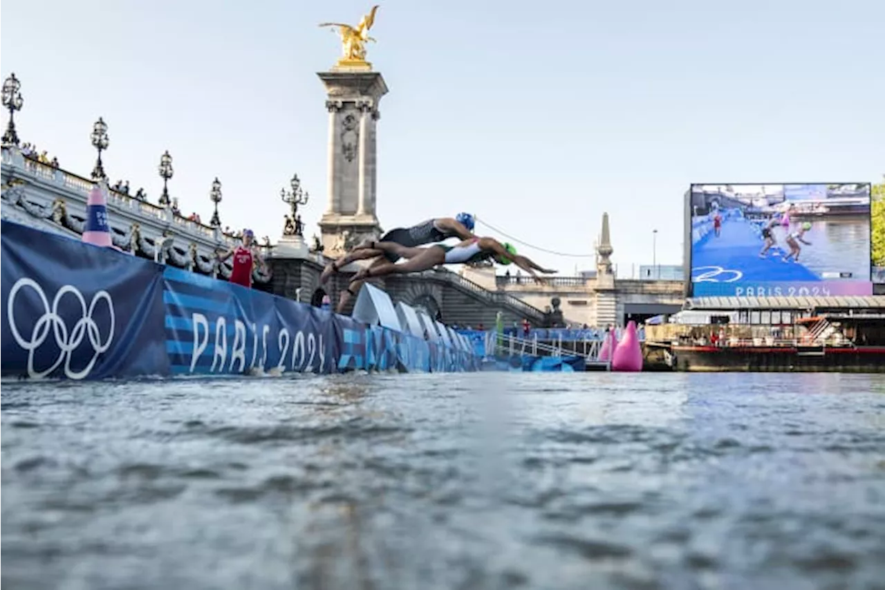 Amid concerns about dirty water and strong current, marathon swimmers dive into the Seine River