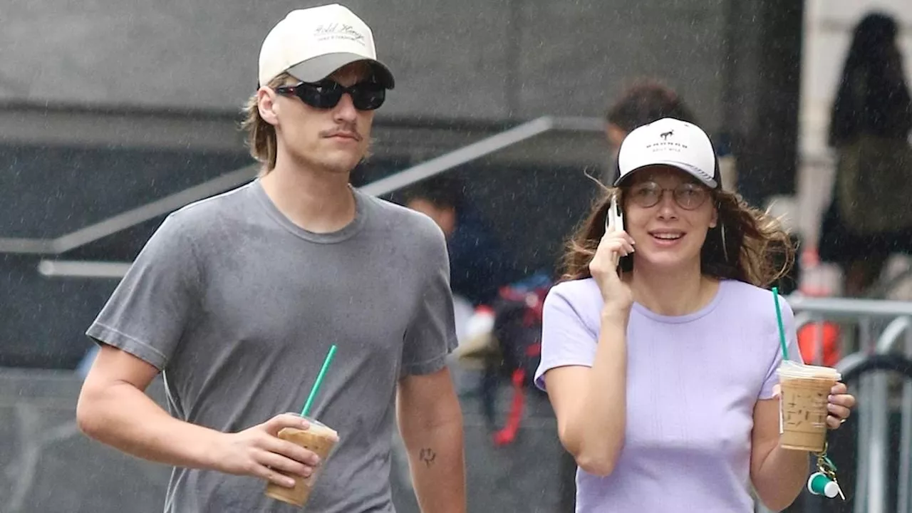 Millie Bobby Brown shows off her taut tummy in a crop top and sweats while enjoying a coffee run...