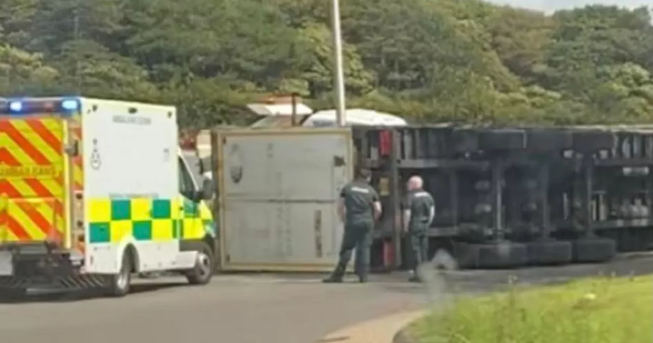 Lorry overturns at busy Scots roundabout as emergency services race to scene