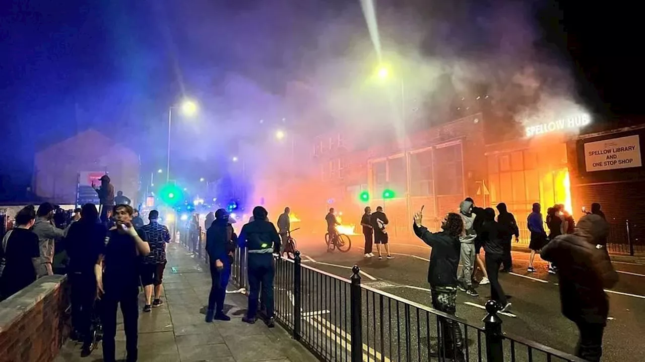 Moment thugs torch library and foodbank amid riots in Liverpool