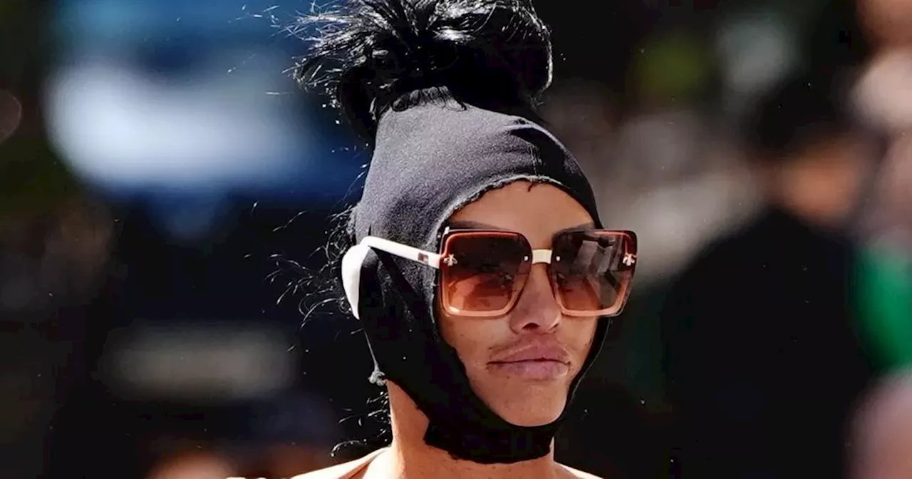 Katie Price arrives at court in head bandage and shades after Heathrow arrest