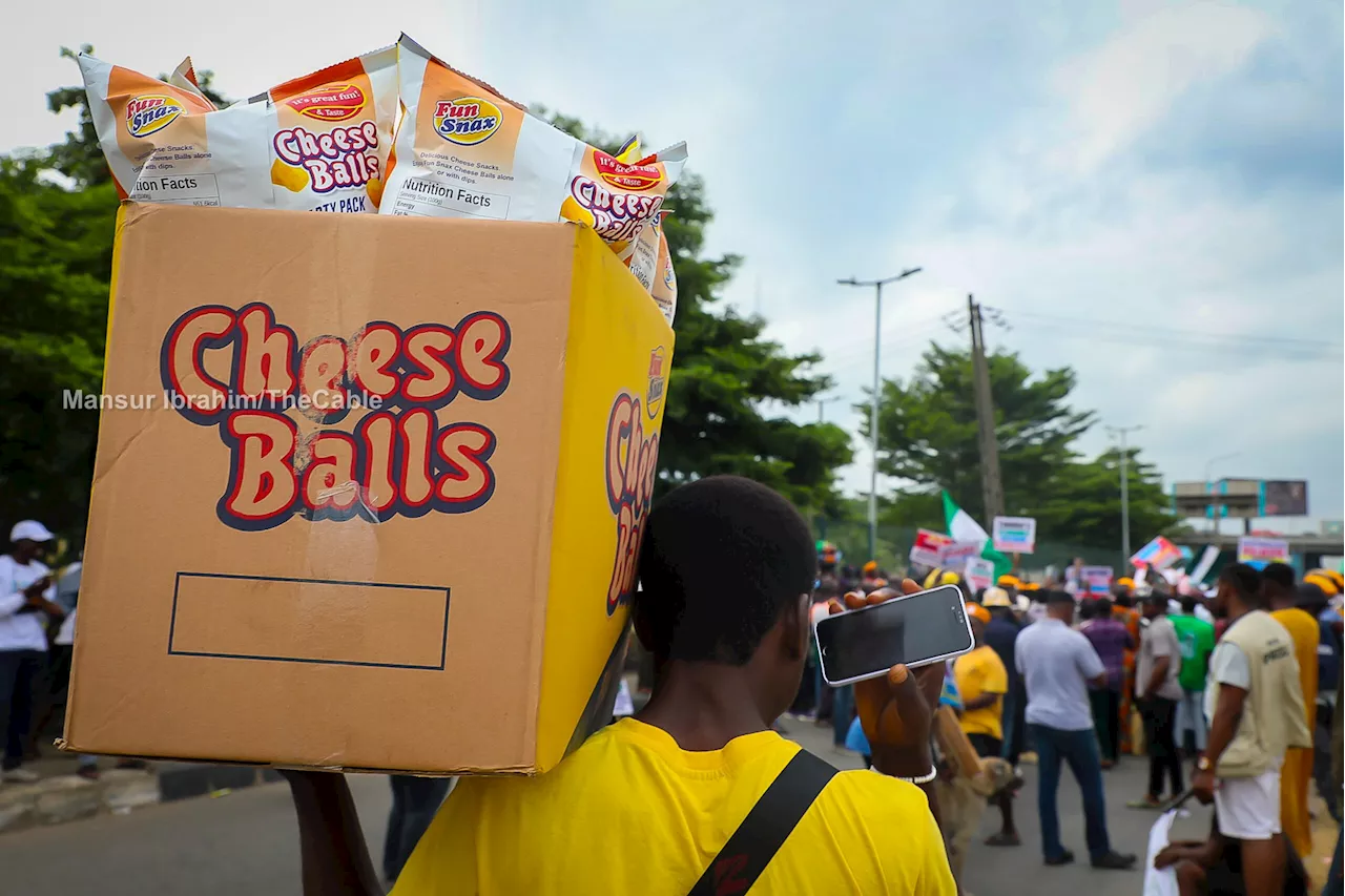 PHOTO STORY: Hawkers 'cashing out' during hunger protest in Lagos