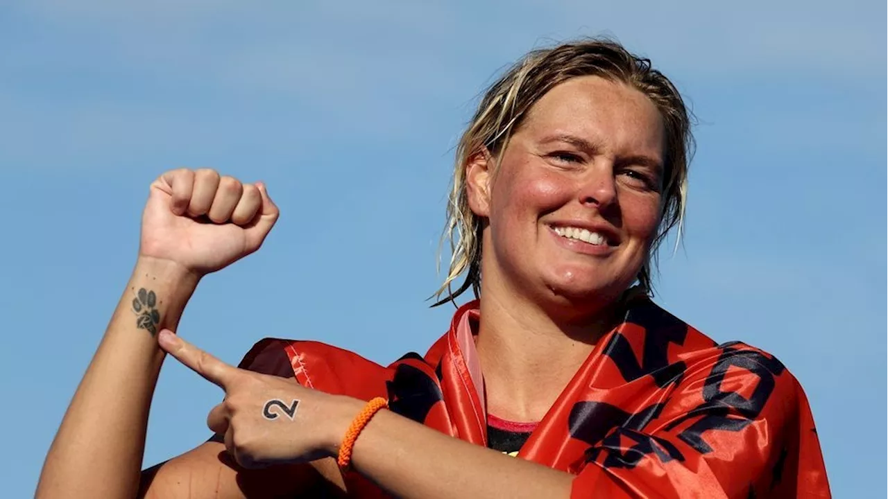 Olympic swimmer wins historic gold medal in memory of her dog, 'he was my little baby'