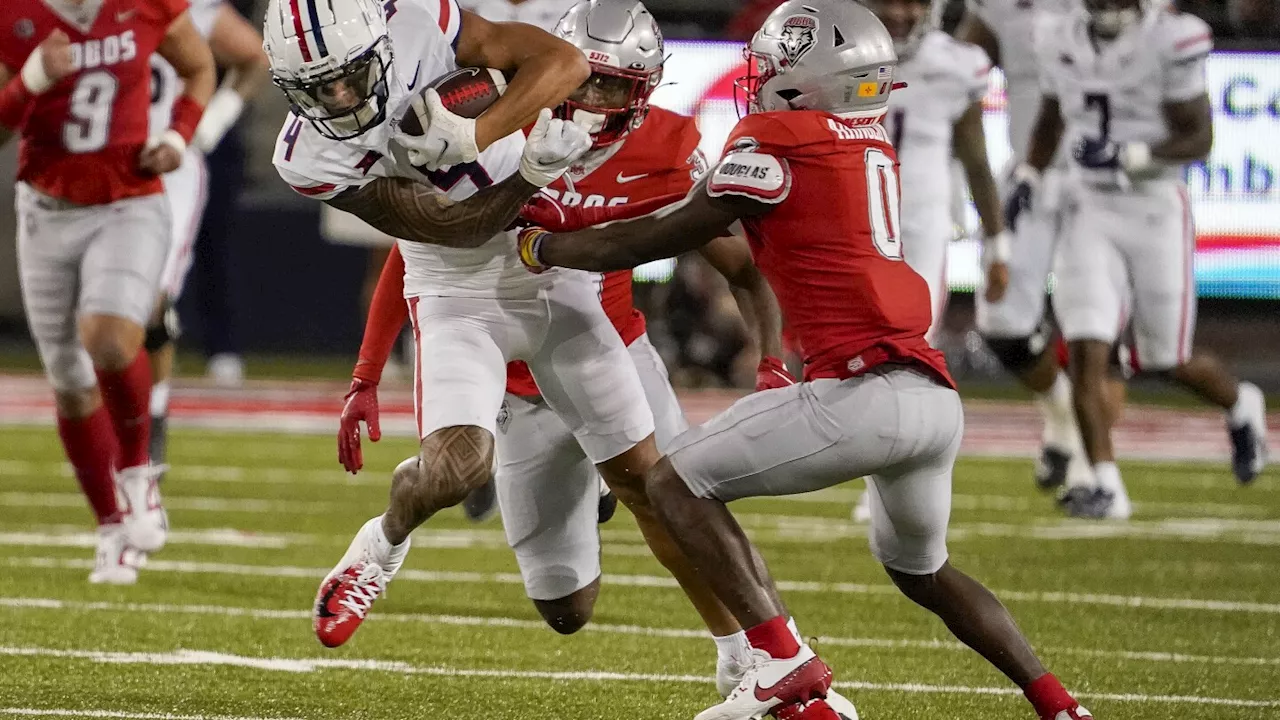 Tetairoa McMillan's record performance lifts No. 21 Arizona to 61-39 win over New Mexico