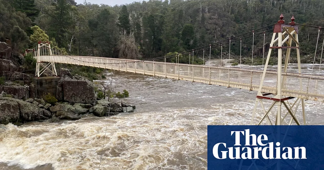 Tasmanians prepare to evacuate amid major flood warning as Victorians warned of destructive winds