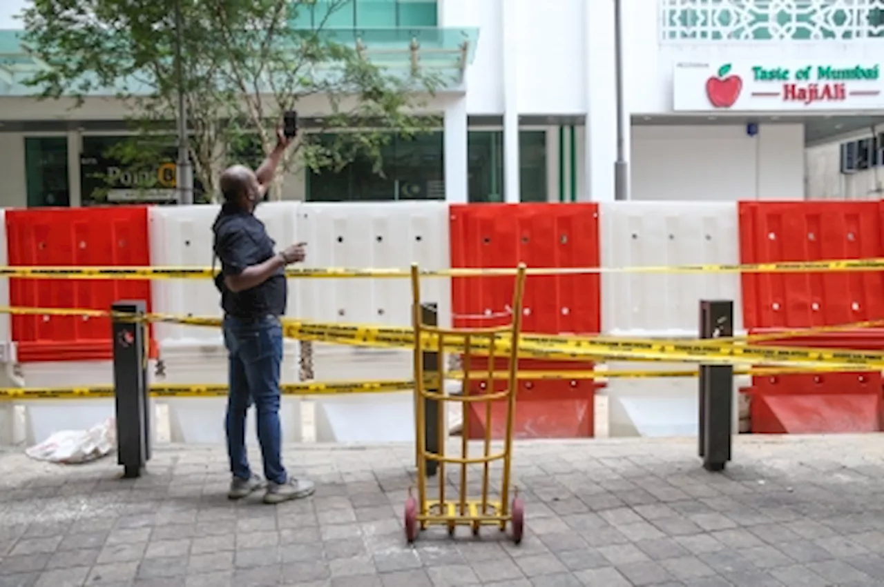 KL’s latest tourist trap: Cordoned off Masjid India sinkhole gathers the curious