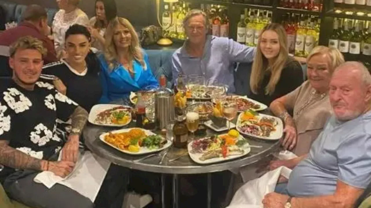 Katie Price beams as she enjoys dinner with rumoured fiance JJ Slater’s family...