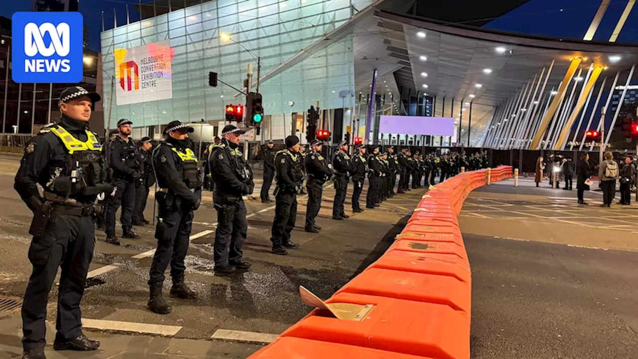 Large crowd of protesters gather at Land Forces defence expo in Melbourne's CBD