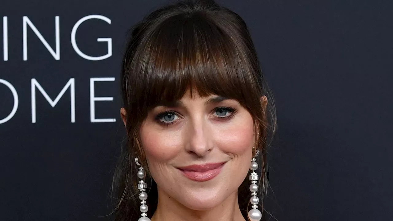 Dakota Johnson appears WITHOUT her engagement ring amid split from Chris Martin after 'drifting...