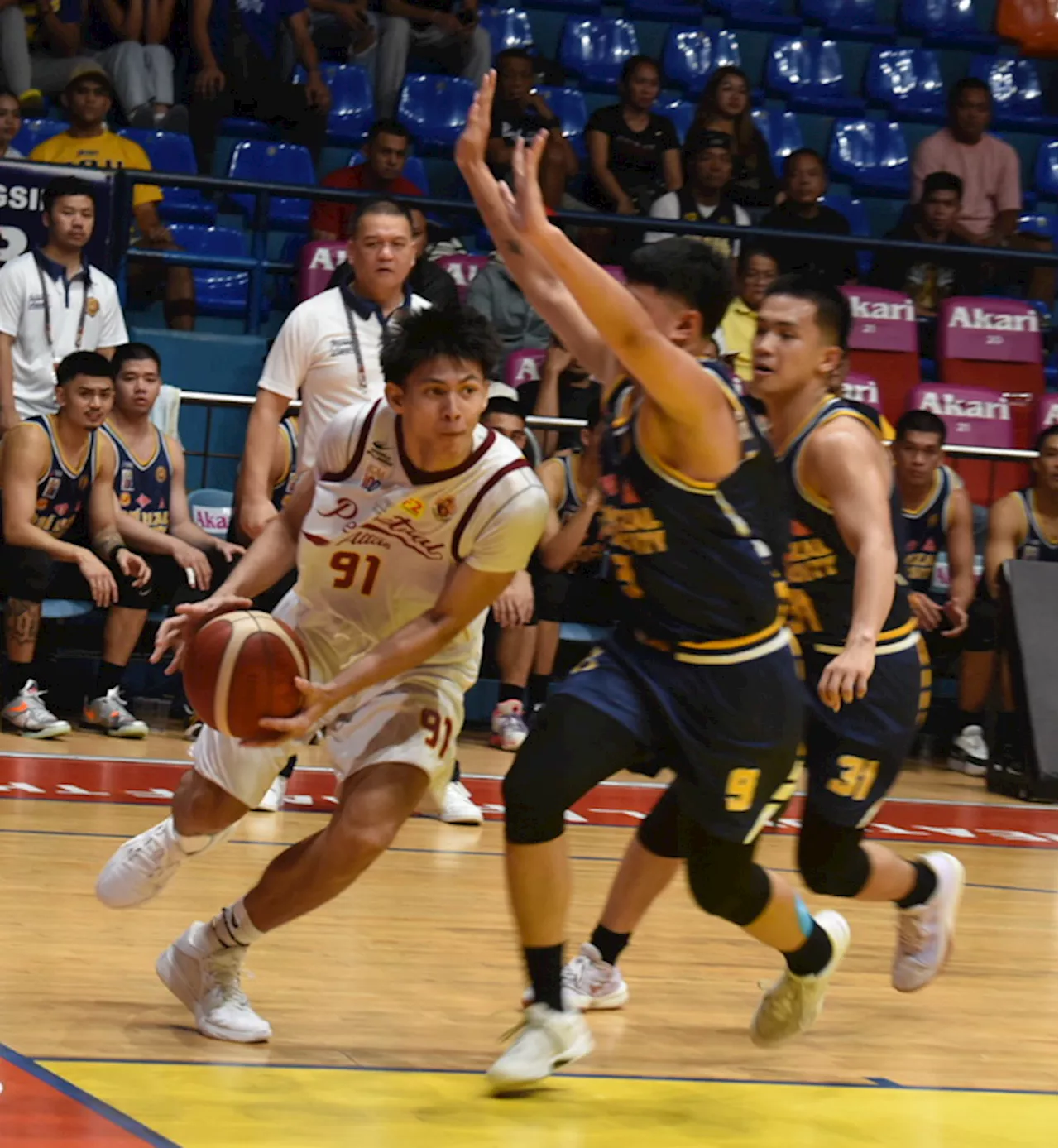 Altas welcome coach Racela with triumph over Bombers