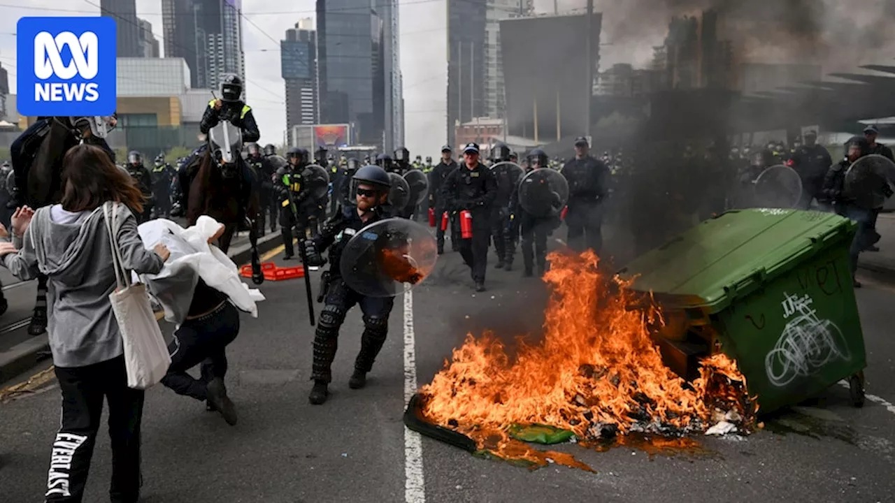 Live: Police condemn violence as dozens of protesters arrested, 24 officers injured