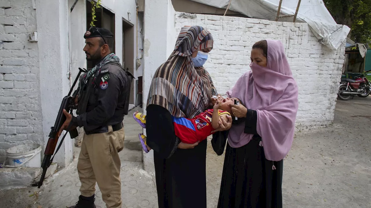 Gunmen on motorcycles kill a Pakistani policeman and a polio worker during a vaccination campaign